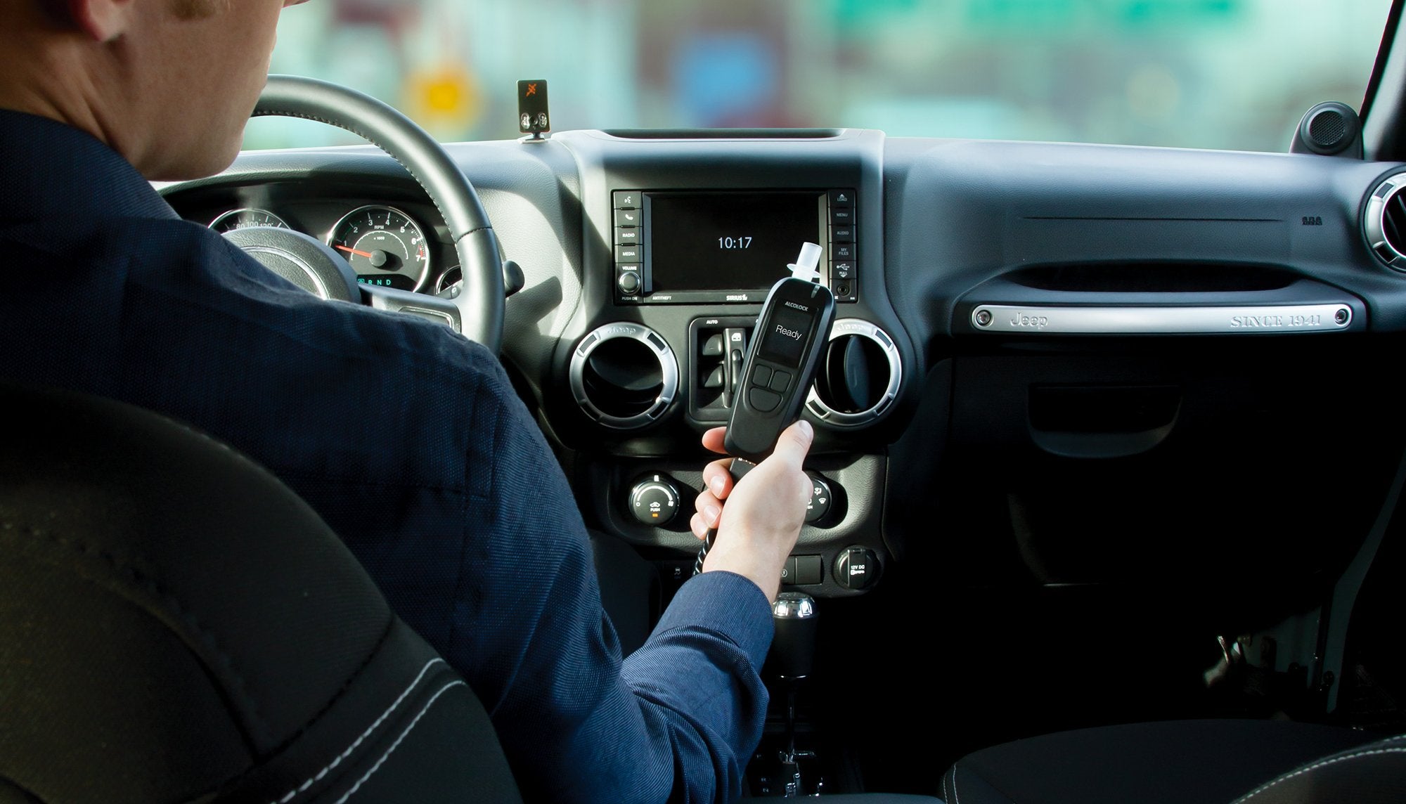 Interlock device installed in vehicle